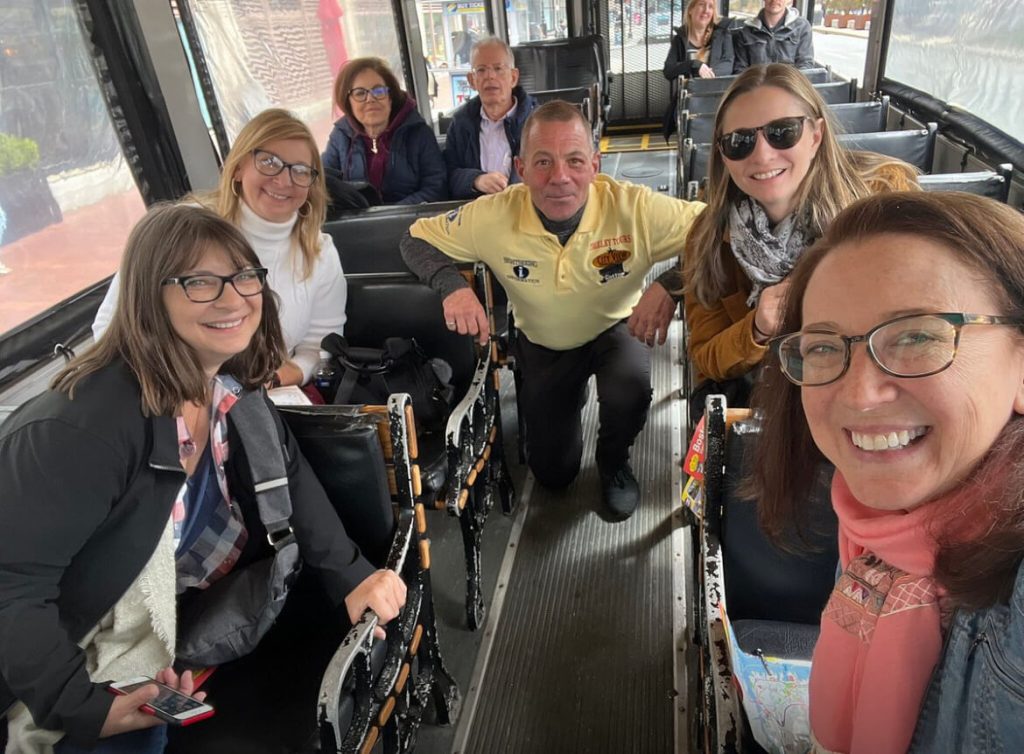 A group of people sitting on a bus together, enjoying the City View Trolley Tours.
